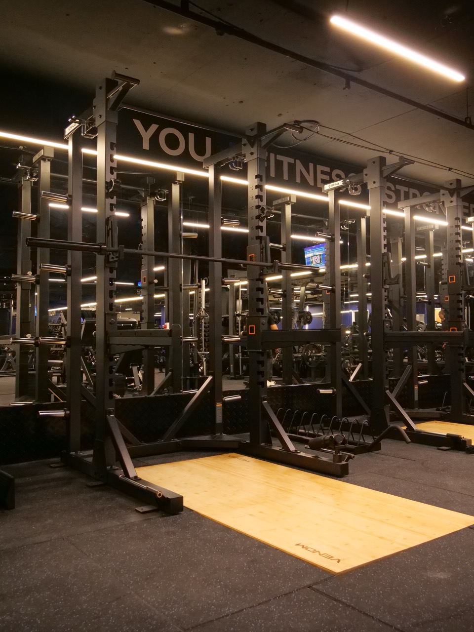 Power racks — integrated barbell storage
